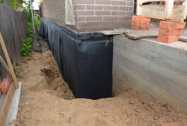 SJ Waterproofing Pros technician performing targeted Emergency Waterproofing assessment in Bloomdale, OH
